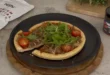 Pizza de champiñones y rúcula